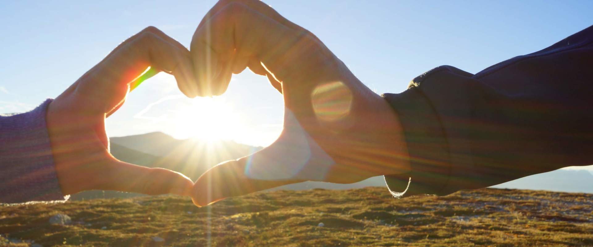 Love Together the hands of a man and a woman form a heart.