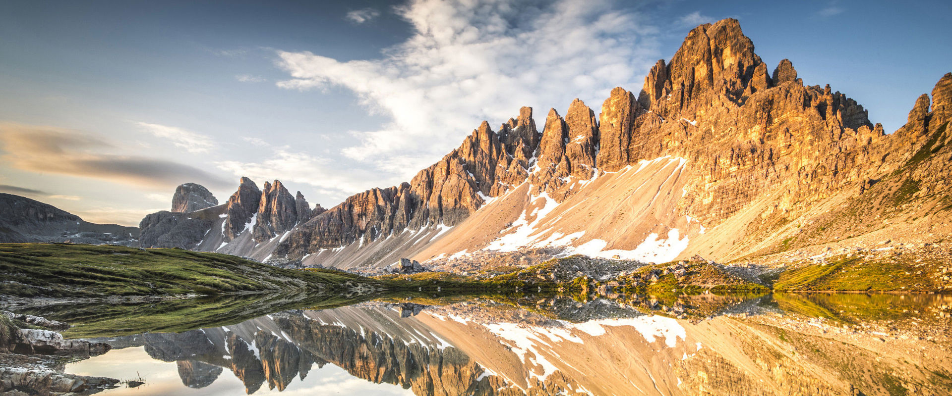 Dolomites high-altitude trails Dolomites high-altitude trails - Mountain peaks reflected in a mountain lake