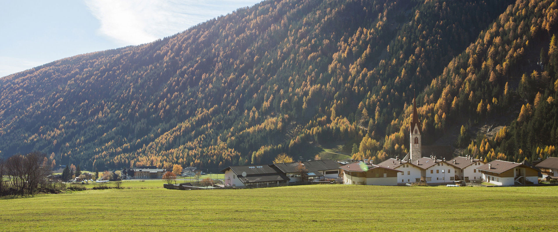 Vals View of Vals & green meadows in autumn