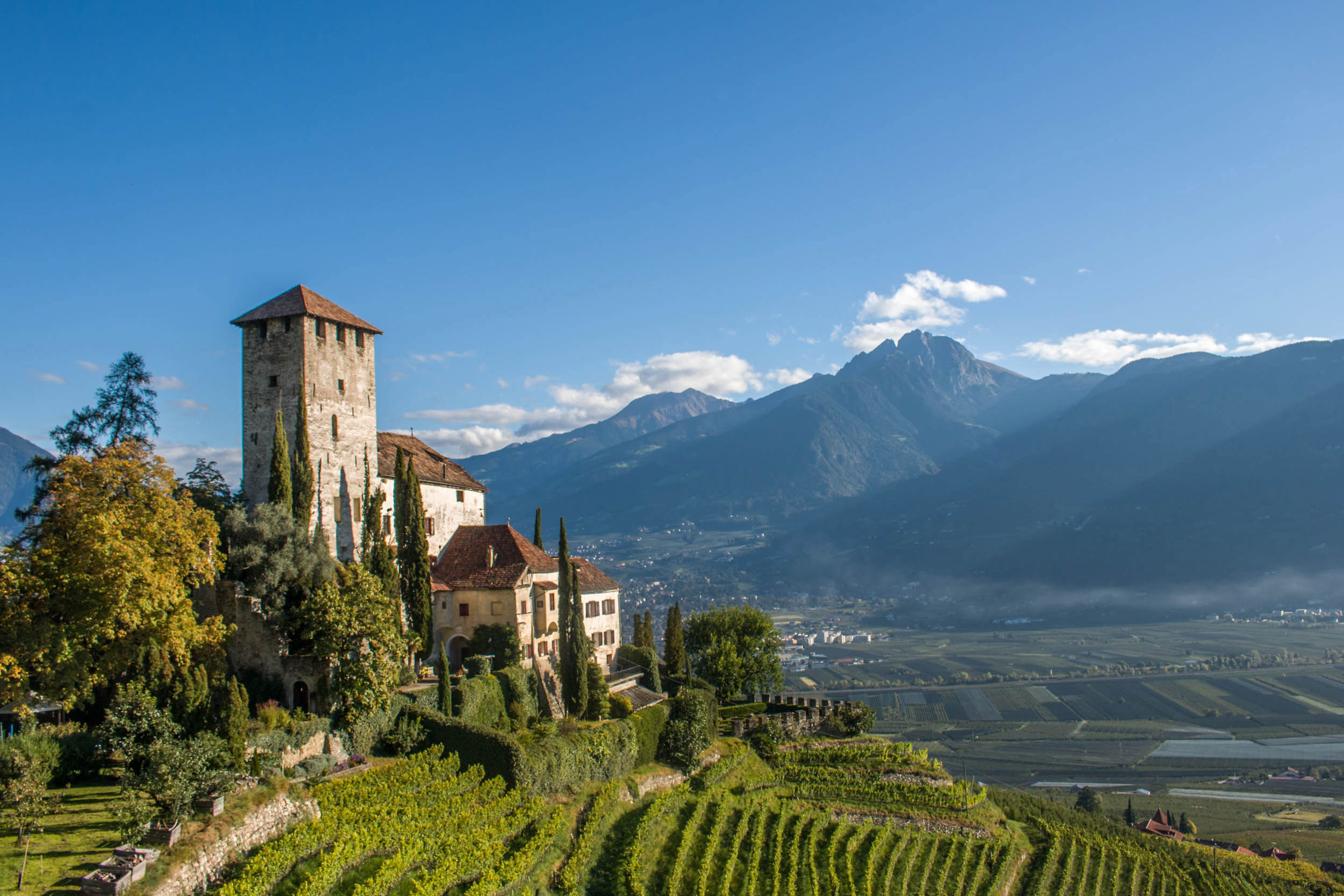 View of the Adige valley and Lebenberg Castle, landmark of the village of Tscherms.