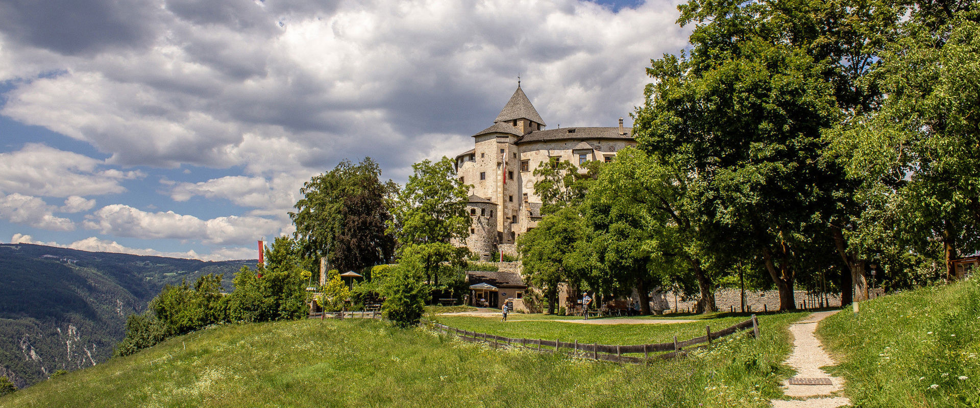 Prösels Castle On a hill in the middle of a meadow and hidden between tall trees, a small path leads to the beautiful Prösels Castle.