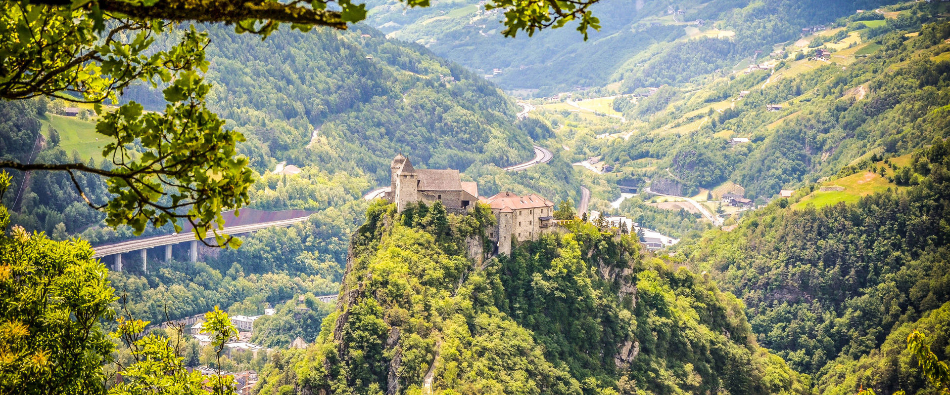The monastery is perched on a peak and surrounded by dense countryside.