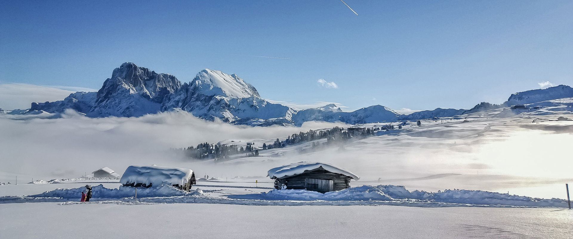 Magical snowy landscape Snow-covered huts in the mountains.