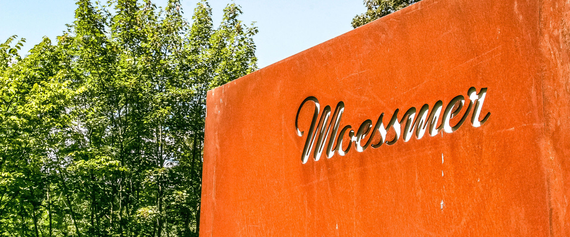 Textile company Moessmer Red shield with lasered logo "Moessmer".