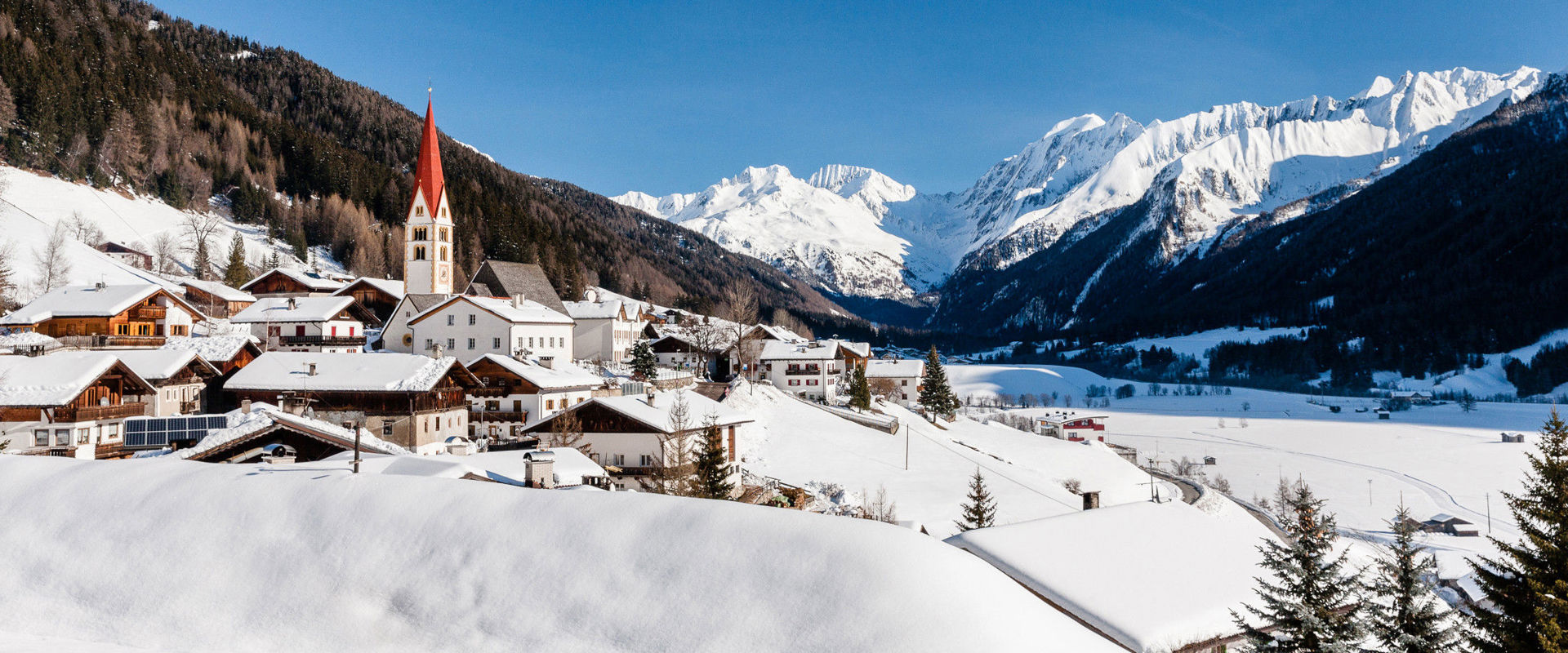 Pfitsch Kematen in Pfitsch Valley with view of snowcovered mountains