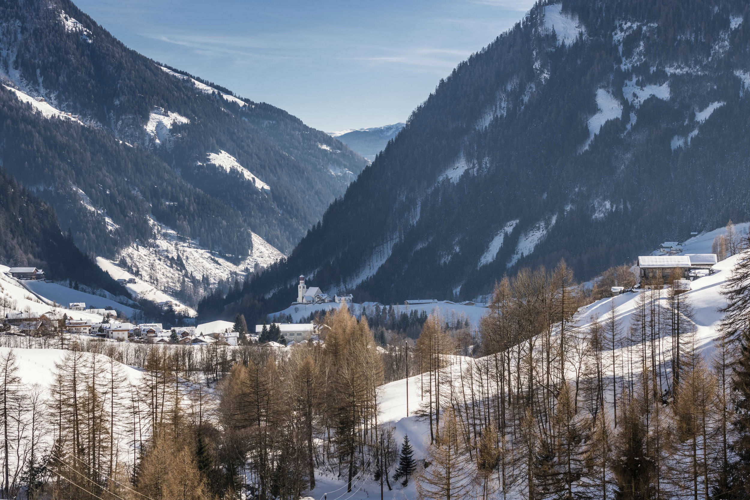 Pfunders with parish church & snowcovered meadows