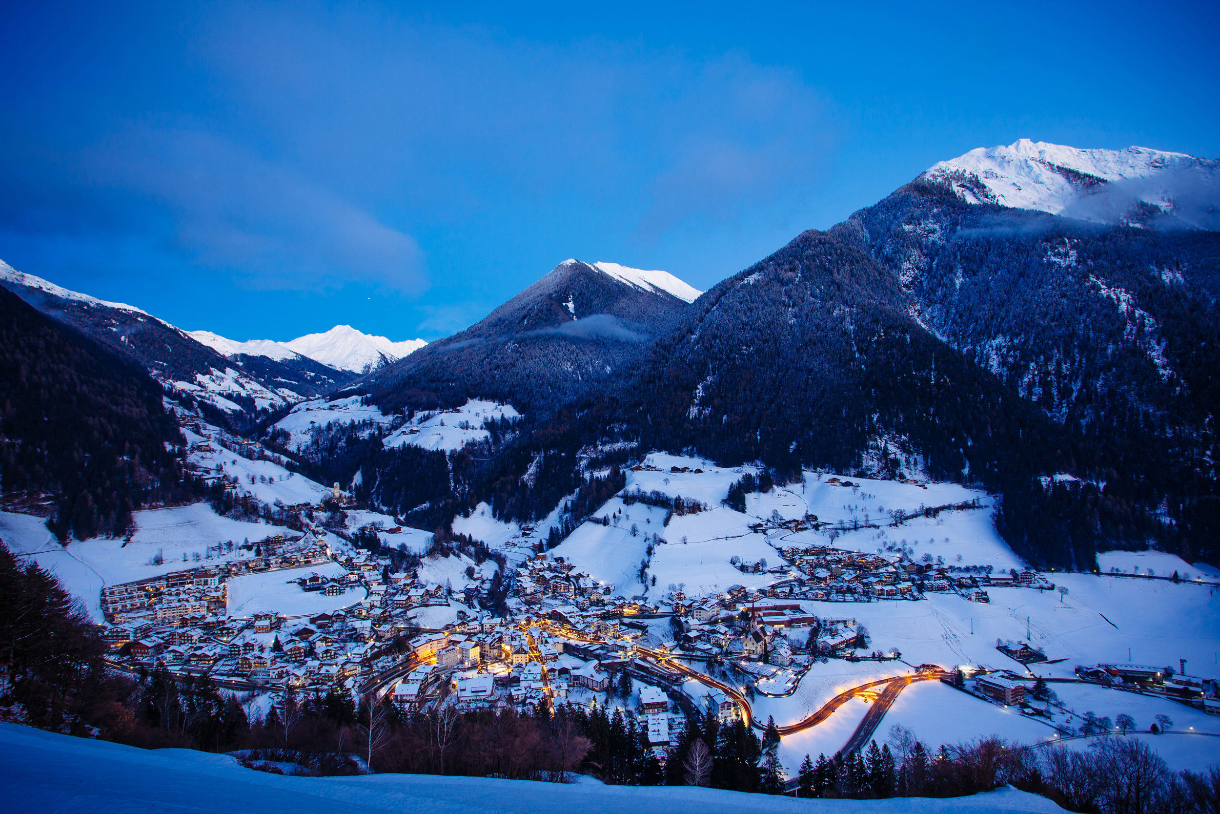 View of the snow-covered valley and the village of St. Leonhard in Passeier.