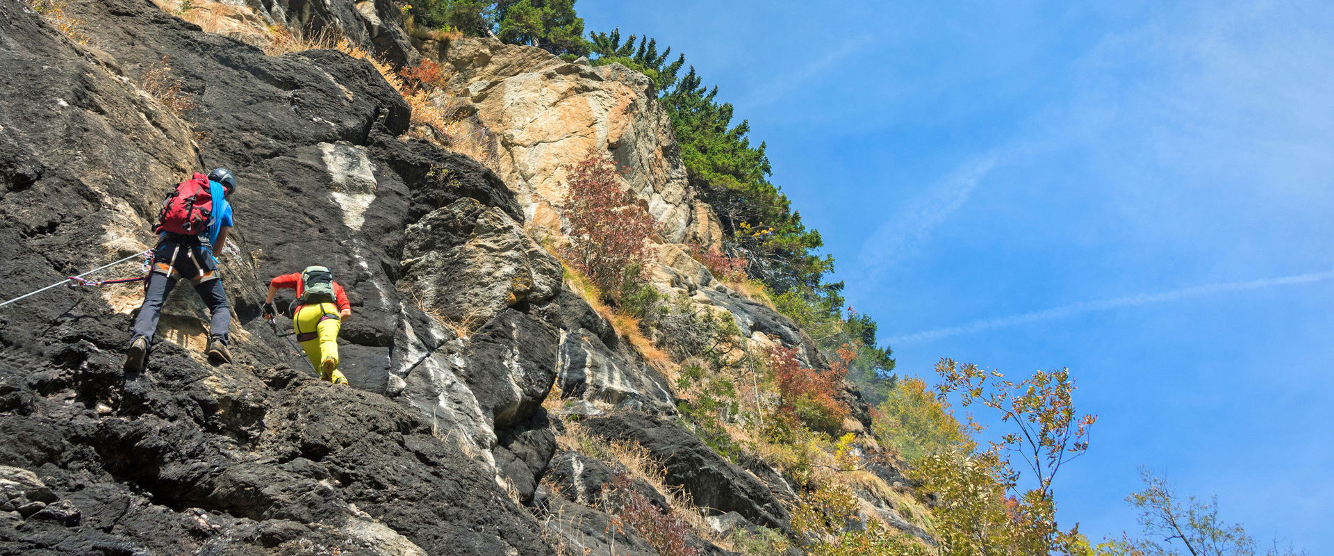 Stuller waterfall via ferrata in the Passeier Valley. A man and a woman climb the Stuller waterfall via ferrata in the Passeier Valley.