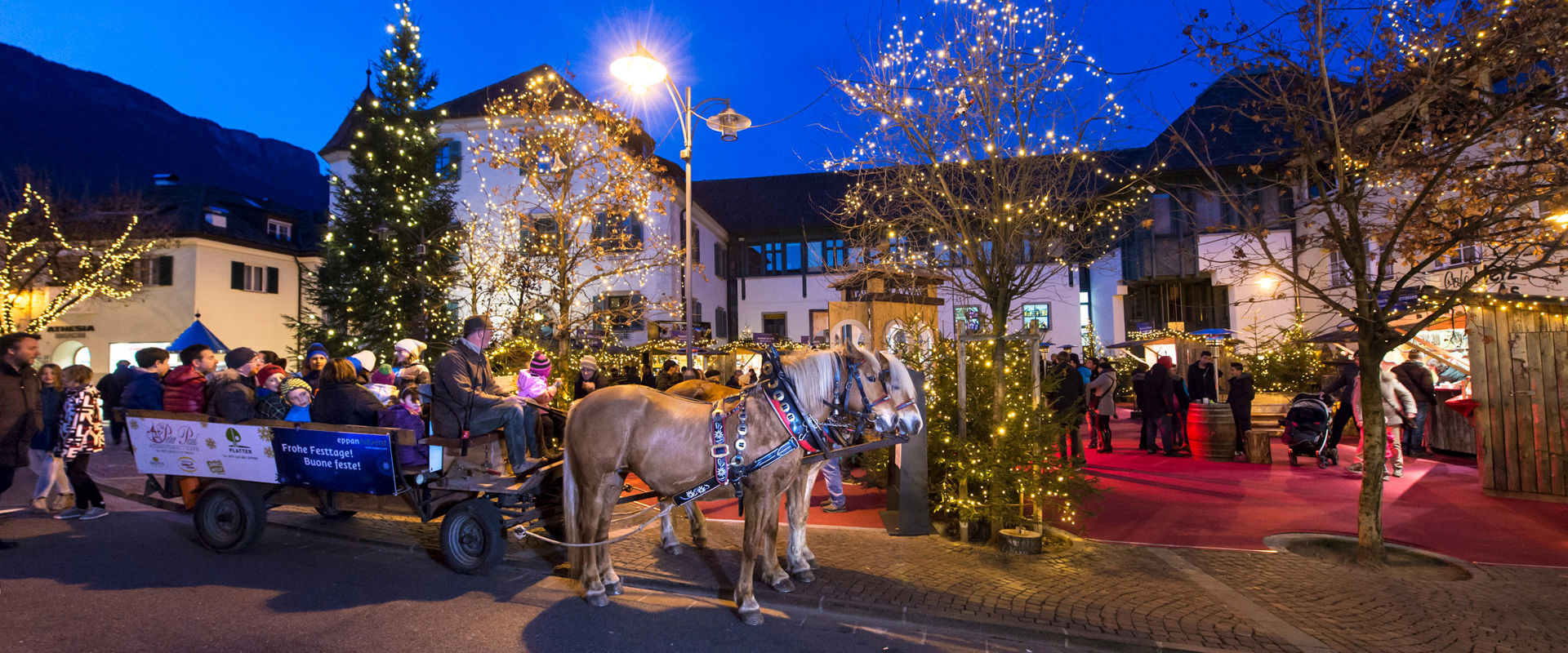 Christmas atmosphere in Eppan Christmas atmosphere in Eppan with horse-drawn carriage and illuminated surroundings