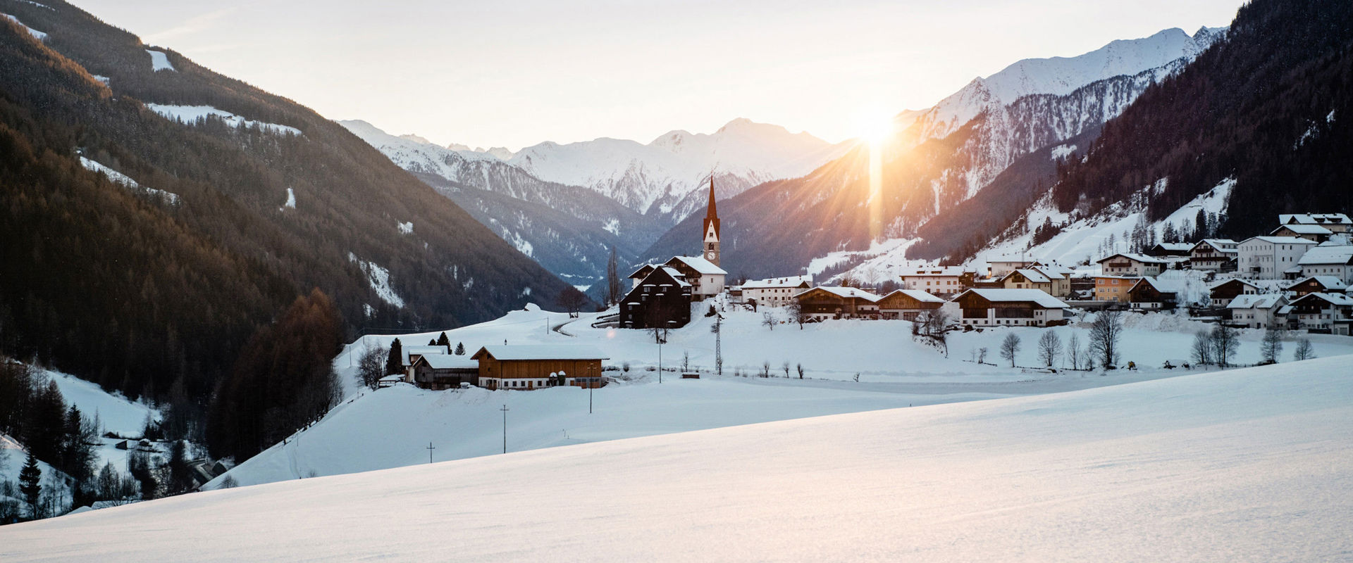 The snow-covered village of St. Jakob in the Ahrntal Valley
