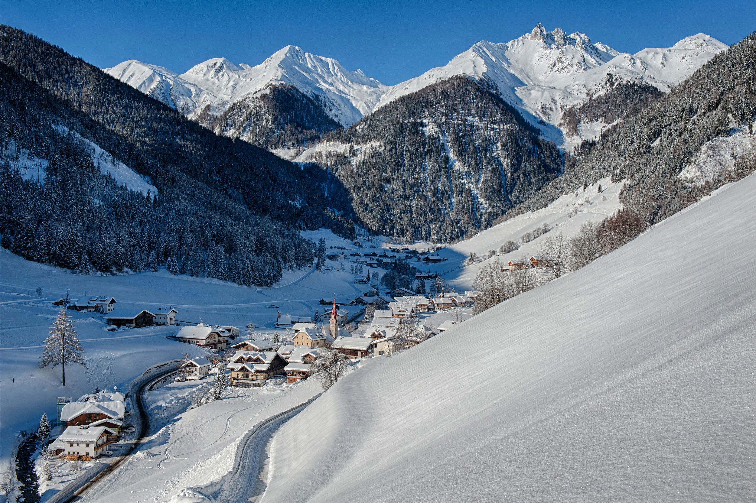 Weißenbach from above in the middle of winter and sunshine.