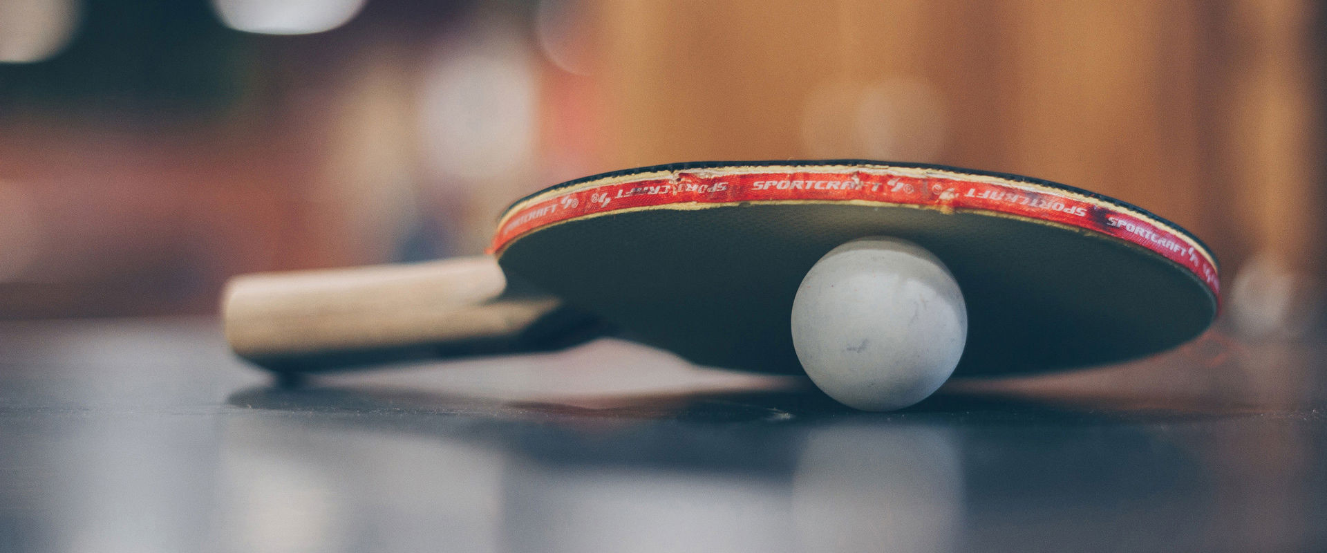 Youth hostels Table tennis bats and ball on the table tennis table.