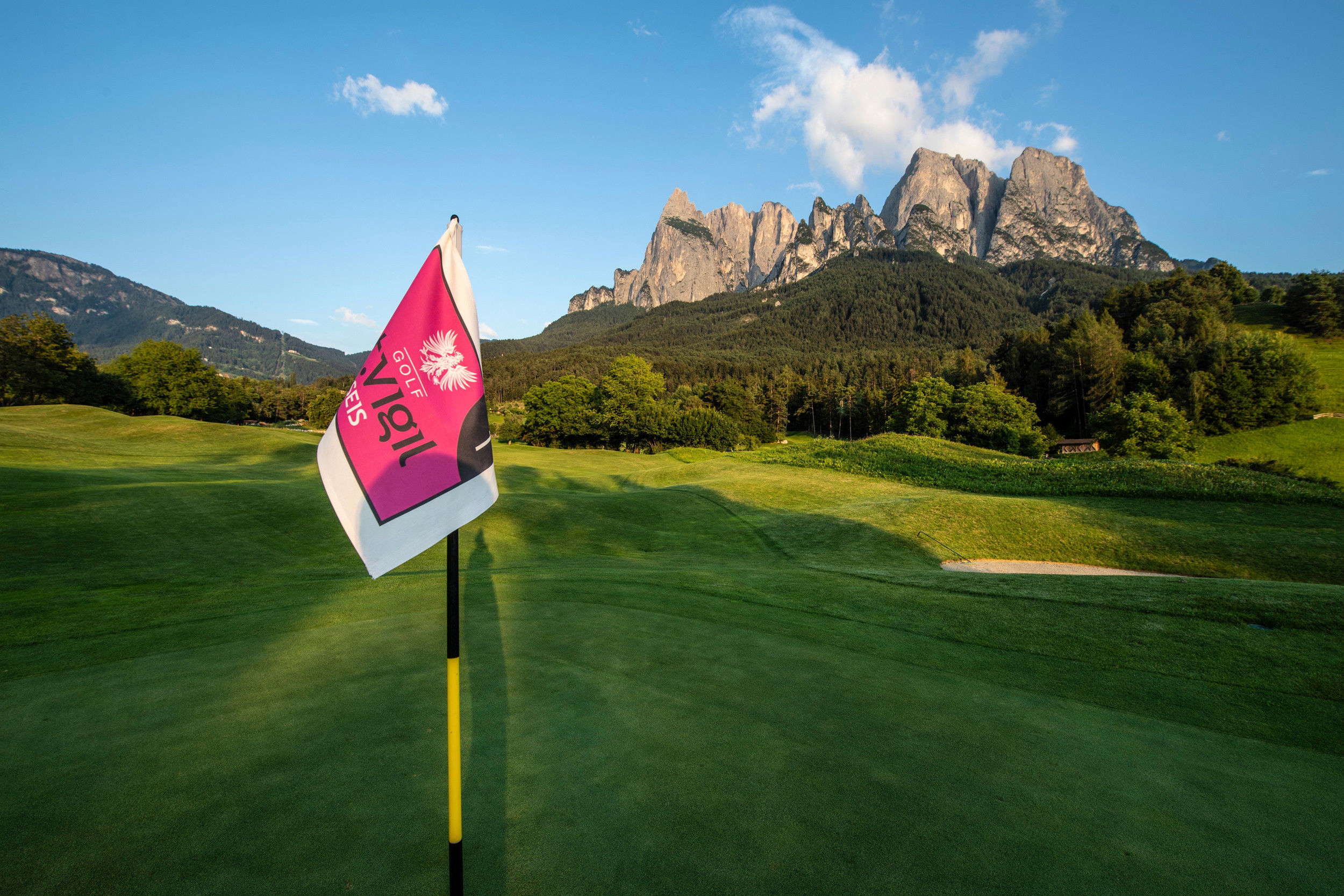 Golf course with a view of the Dolomites.