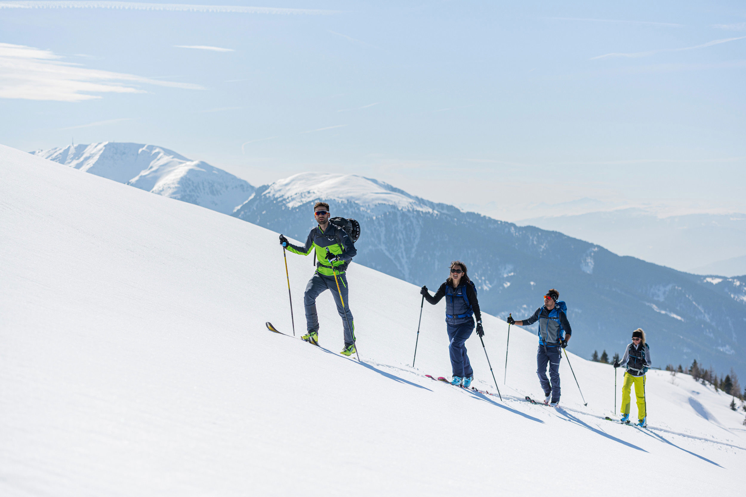 Ski tourers go up the mountain.