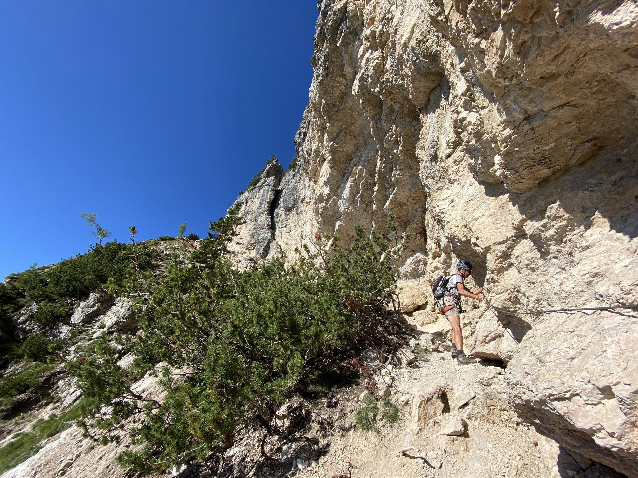 Man climbs the Monte Roen via ferrata.