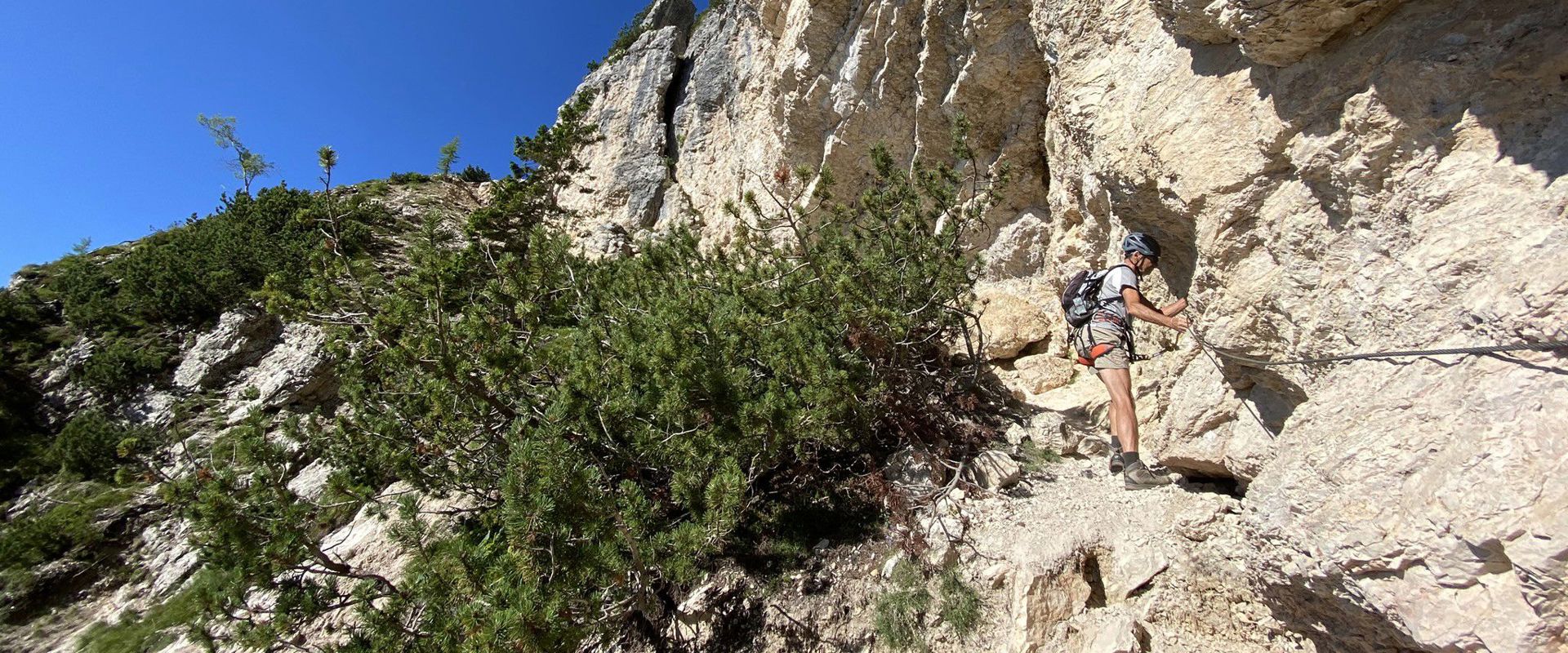 Monte Roen via ferrata Man climbs the Monte Roen via ferrata.