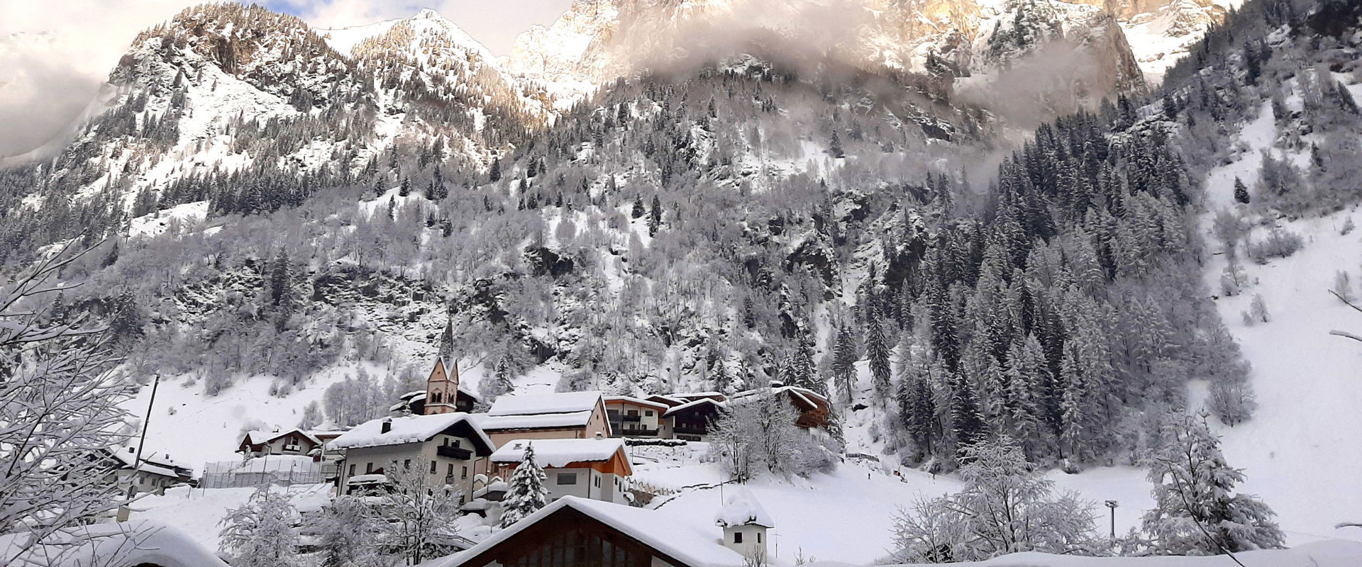 Pflersch Pflersch with church in winter & snowcovered mountain landscape