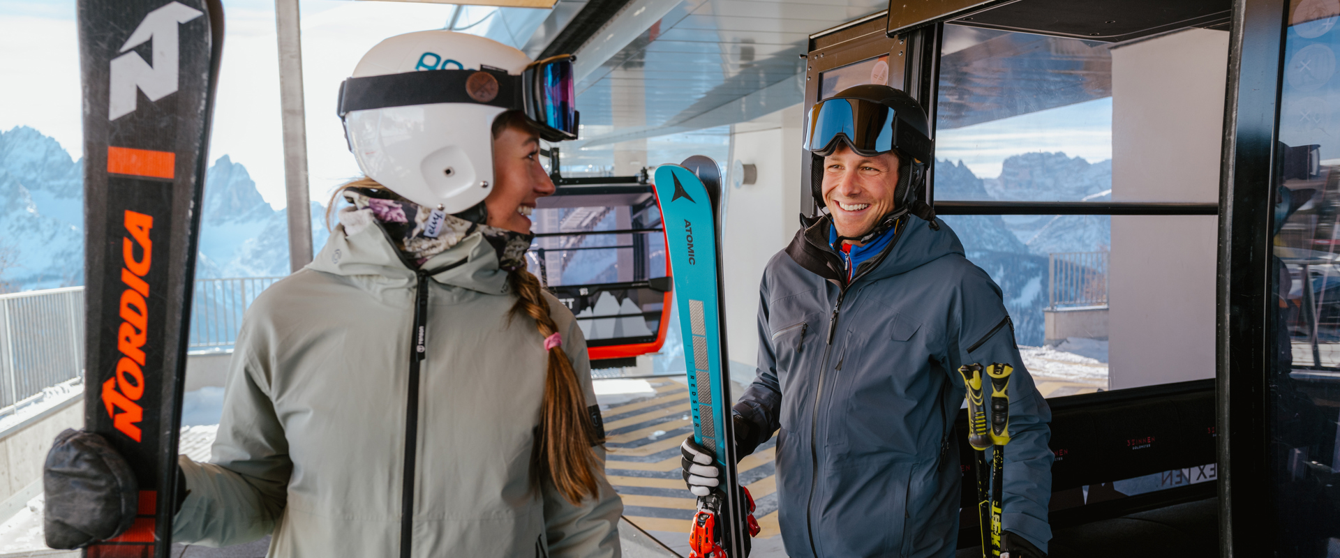 Cableway 3 Zinnen Dolomites Two skiers get off the cable car