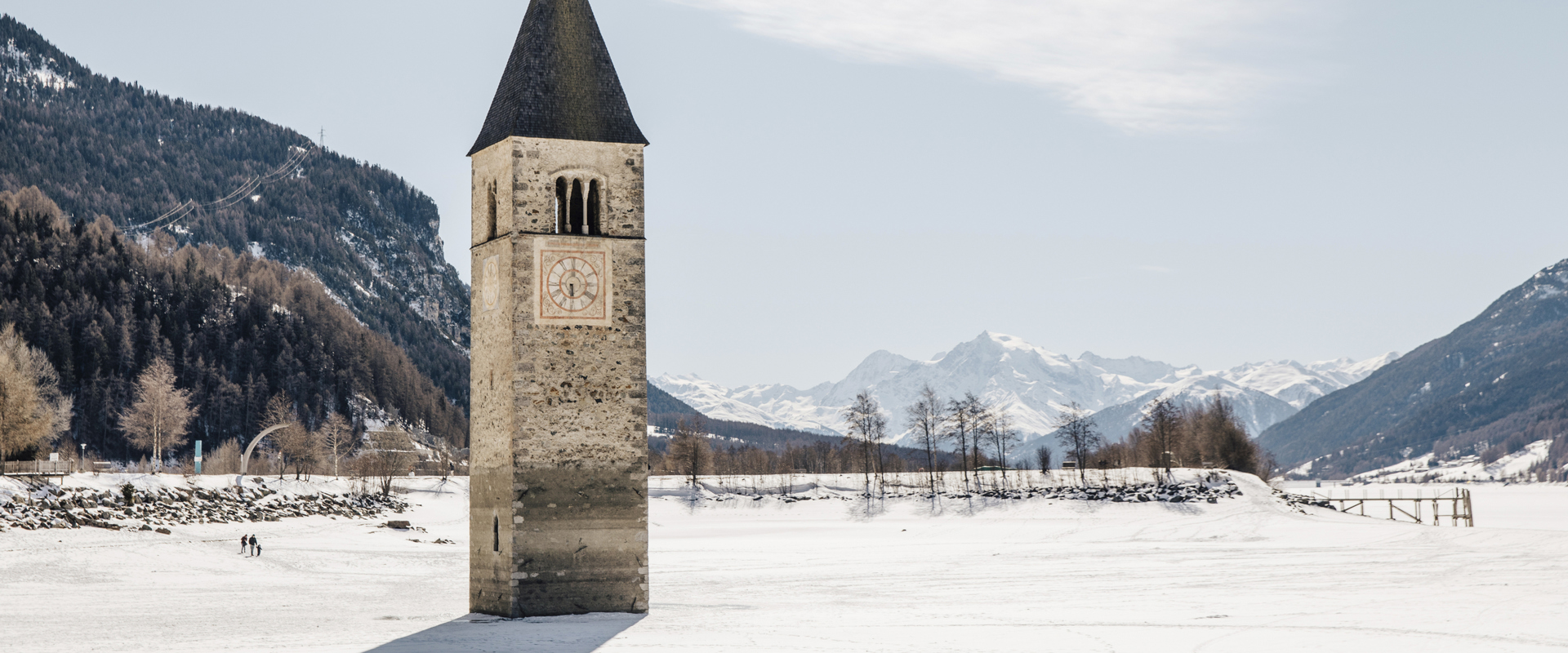 Lake Reschen Church tower emerging from frozen Lake Reschen