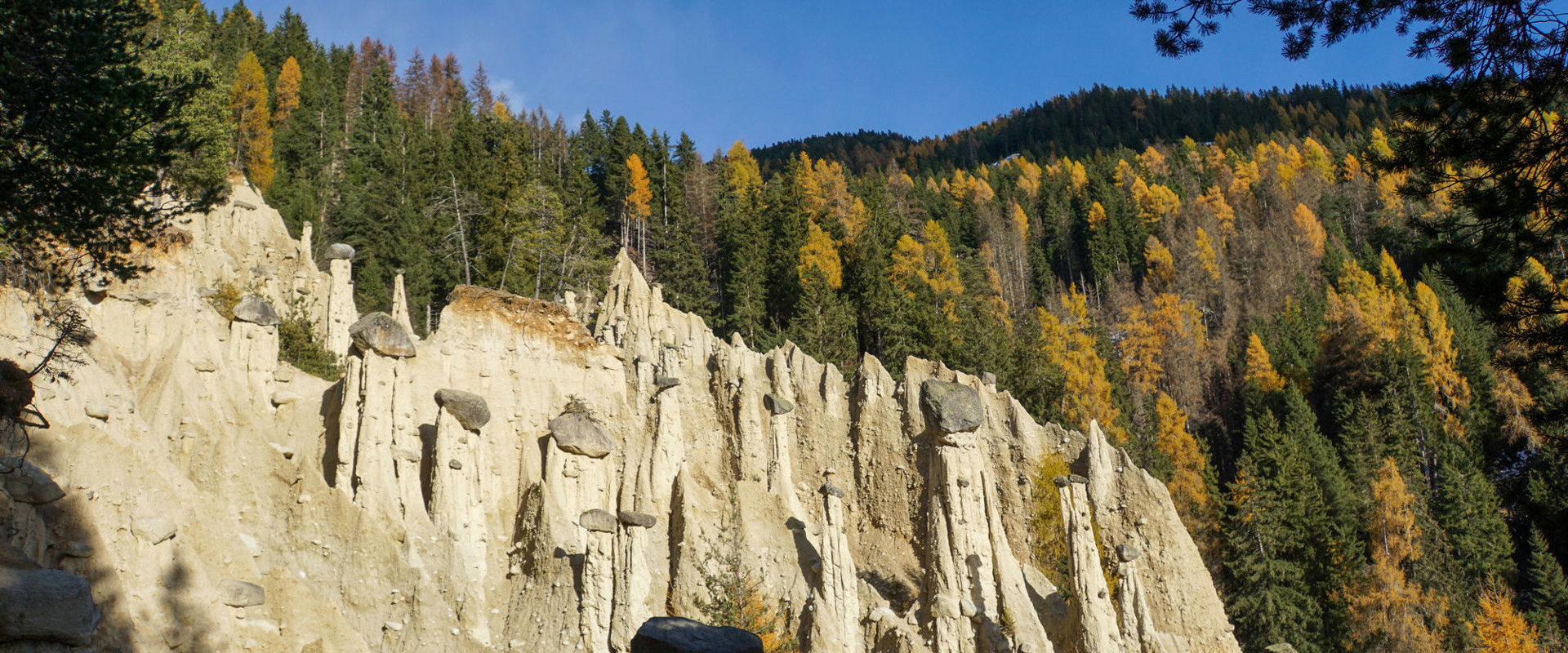 Earth pyramids Earth pyramids with autumn wood