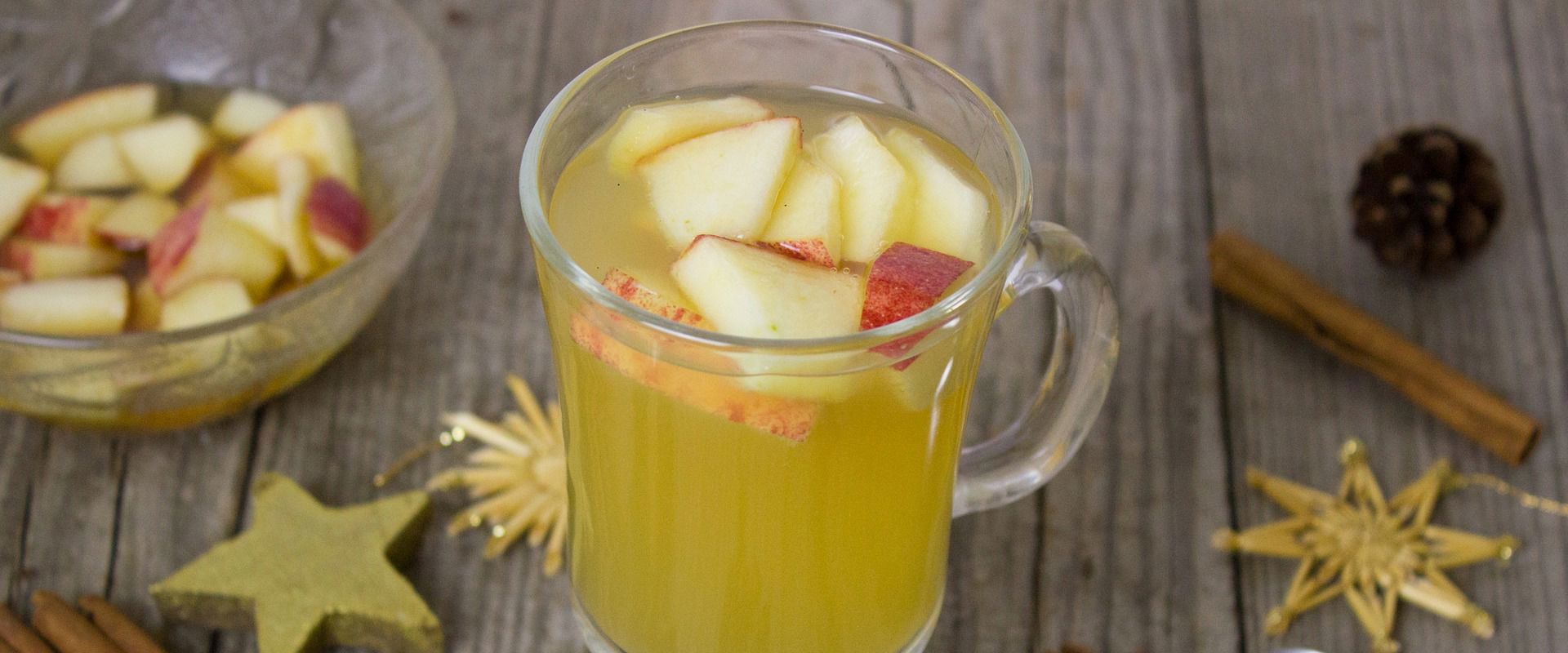 Apple punch Mug with apple punch and decorative elements.