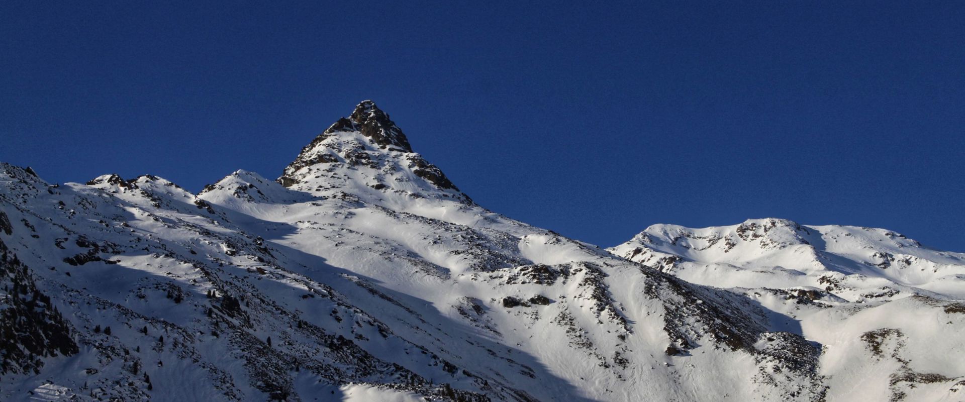 Snow-covered mountain peaks.